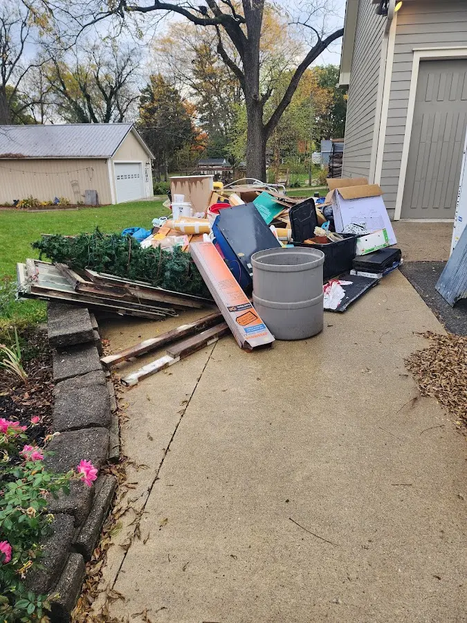 Dumpster being loaded with debris for Estate Cleanout Dumpster Rental in Terrytown